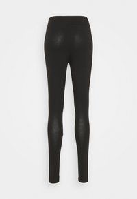 Leggings neri realizzati in materiale elastico, caratterizzati da una forma adatta e una texture liscia, con una vita alta e senza motivi o accenti visibili.