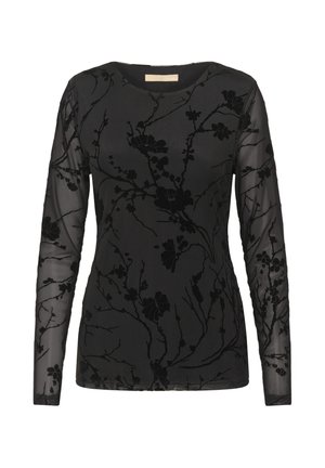 Blouse noire à manches longues avec des manches translucides et un motif floral texturé, dotée d'un décolleté en forme de scoop et d'une silhouette ajustée.