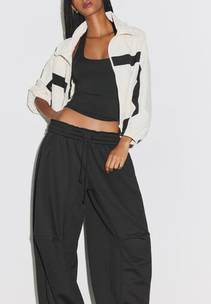 Stradivarius, BALLOON JOGGER TROUSERS WITH STOPPERS 07307455 - Tepláky - black