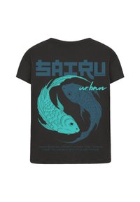 Black t-shirt featuring a teal graphic of two koi fish in a circular design, with the text "SAIRU urban" above and a slogan below.