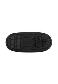Suela de zapato de goma negra con patrones de agarre texturizados, que incluyen formas circulares y rectangulares, y una sección central lisa.