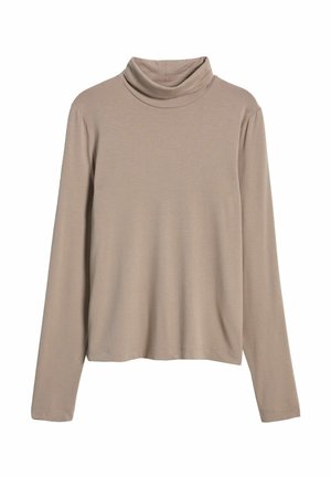 Beige polotröja med långa ärmar, tillverkad av ett mjukt tyg, med en lös passform och minimal sömdetalj vid fållen och ärmsluten.