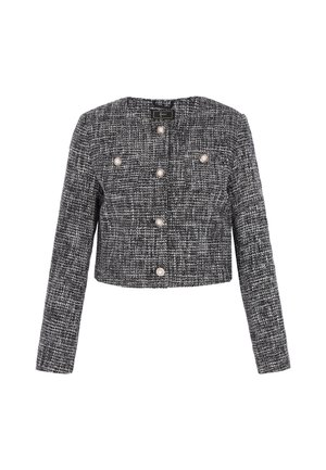 Przycięta czarno-biała marynarka z tweedu z długimi rękawami, z sześcioma okrągłymi guzikami przypominającymi perły i okrągłym dekoltem. Teksturowana powierzchnia tkaniny.