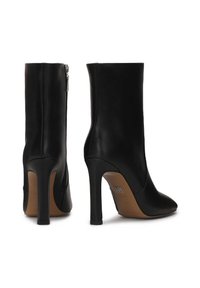 Black leather ankle boots with a pointed toe and high stiletto heel. Features a side zipper and smooth texture. Simple design without embellishments.