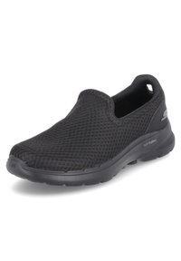Schwarzer Slip-On Sneaker mit atmungsaktivem Mesh-Obermaterial, gepolsterter Sohle, die mit "Hyperpillars" gekennzeichnet ist, und Zuglasche an der Ferse für einfaches Anziehen.
