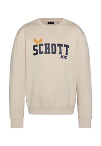 Felpa beige con maniche lunghe e scollatura a girocollo. Presenta il logo "SCHOTT" in blu navy e giallo. Tessuto in morbido cotone, con polsini e orlo a costine.