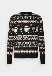 Pull de Noël noir avec des flocons de neige blancs, des zigzags rouges et des visages du Père Noël portant des lunettes de soleil, répartis uniformément autour de la poitrine et des manches.