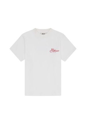 T-shirt blanc à manches courtes avec petit logo rouge "Ellesse EST 1959" sur le côté gauche de la poitrine. Design simple avec col rond.