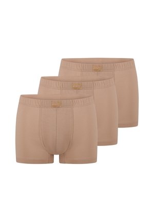 Tre boxer beige da uomo con fascia elastica in vita e tasca frontale, disposti in fila sfalsata.