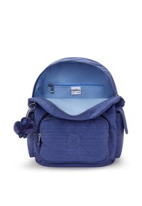 Purple nylon backpack with a textured finish, featuring an inner pocket, a front zip pocket, and a furry monkey keychain.