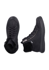 Bottines noires en cuir, présentant une finition texturée, un design à lacets et un détail de zip sur le côté pour un enfilage facile. Le col en fourrure ajoute de la chaleur.