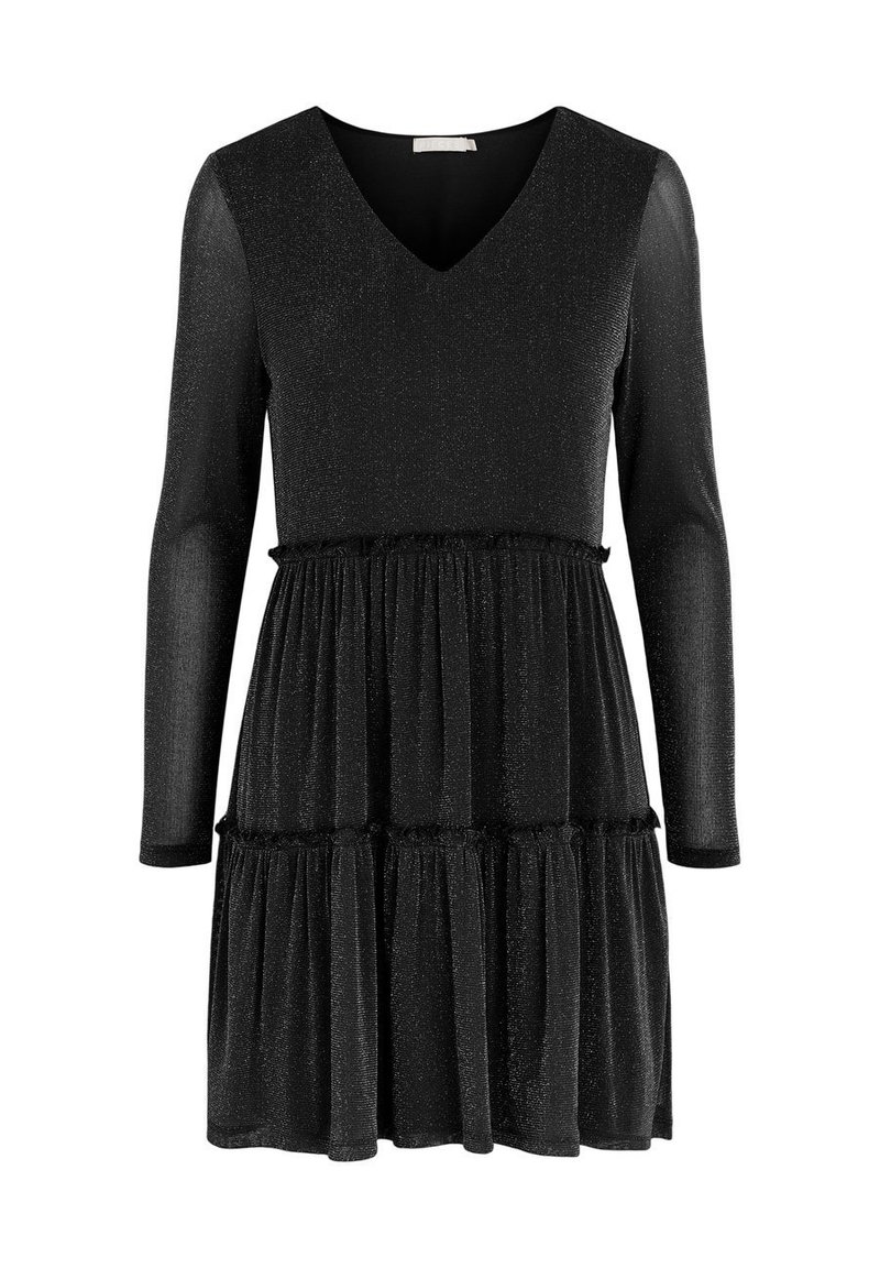 Svart klänning med lång ärm, V-ringning och lager-på-lager kjol. Tillverkad av textil med en subtil glans. Har volangdetaljer vid midjan.