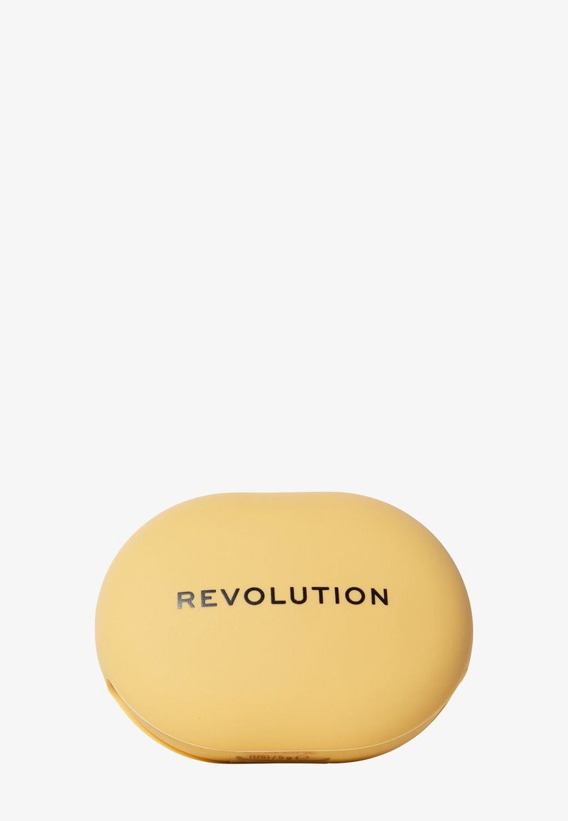 Gelbe ovale Makeup-Compact mit glatter Textur und schwarzem "REVOLUTION"-Logo auf der Vorderseite, mit einem Design aus abgerundeten Kanten.