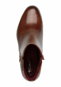 Brown leather ankle boot with a smooth finish, almond toe shape, side zipper, and burgundy interior lining. Decorative stitching at the side.