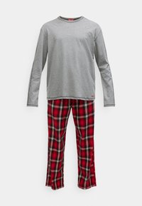 Long-sleeve gray top paired with red and black plaid pajama pants on a white background.