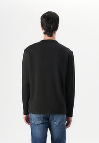 Tommy Jeans Topper langermet - black
