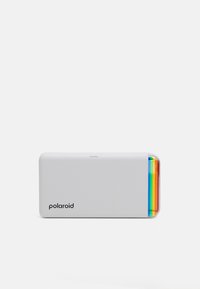 White portable printer with a smooth finish, featuring a rainbow-colored accent on the side and the "Polaroid" logo printed on the front.