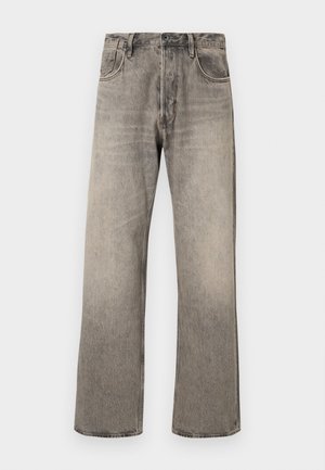 Lys grå, vide jeans laget av denim med en falmet overflate. Har tradisjonell fem-lomme-design og beltehemper.