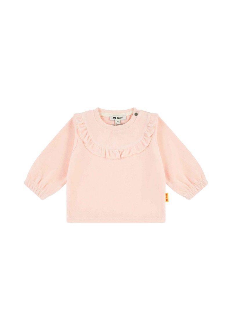 Camisa de manga larga de color rosa claro con cuello fruncido y mangas abullonadas. Diseño simple con cierre a presión en el cuello. Textura de tela suave.