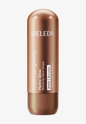 Weleda Cell Longevity Hydra Glow Gouttes Éclat Bronzant avec Booster NAD+ et Acide Hyaluronique dans un contenant bronze en forme de capsule.