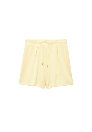 Lysegule shorts med højtaljet talje, foran med plisseringer og snøre i taljen, vist mod en hvid baggrund.
