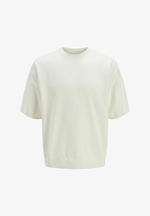 Kortermet, offwhite strikkegenser med ribbestrikket rund hals, mansjetter og kant, vist på en ensfarget hvit bakgrunn.