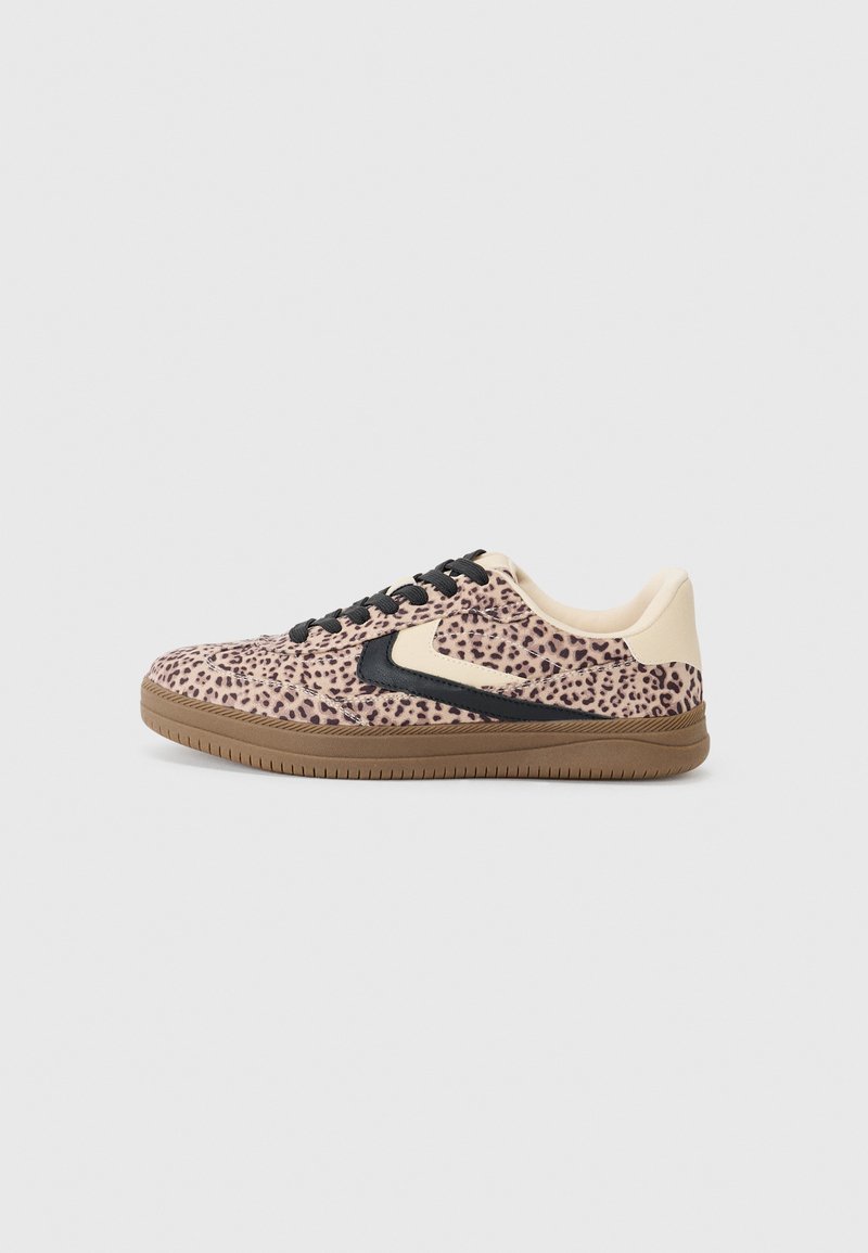 Leopard print sneaker with a pink base, black accents, and textured upper. Features black laces and a rubber sole.