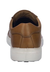 Brown leather sneaker with a smooth finish, white rubber sole, and minimalistic design, featuring a curved back and stitching details.