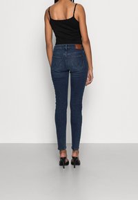 Wrangler Jeans Skinny Fit - dark-blue denim