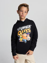 Felpa con cappuccio nera con una grafica vivace di personaggi dei cartoni animati e la scritta audace "STUMBLE GUYS". Tessuto morbido con vestibilità comoda e tasca frontale.