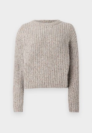 Crochet-style sweater in a light beige with subtle multicolor flecks, featuring a round neck and long sleeves in a loose fit design.