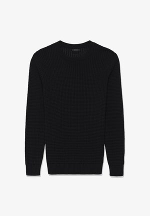 Črn pleten dolg rokav pulover s krojnim ovratnikom in rebrastimi manšeti ter robom, s teksturiranim vafl protagonistom.