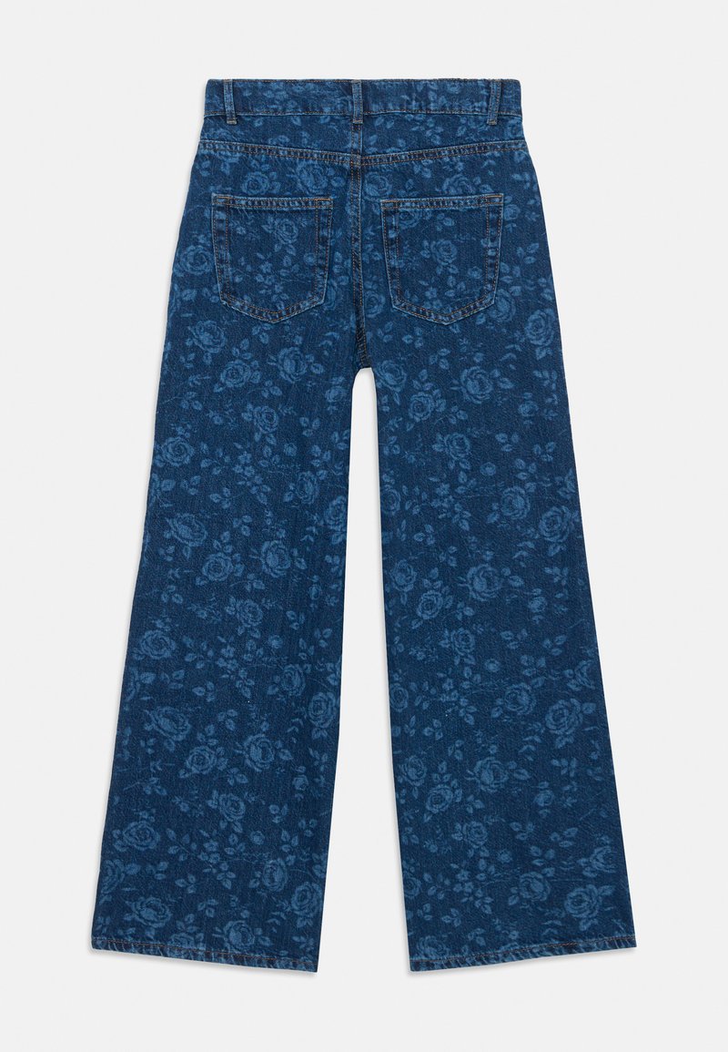 Jeans évasés en denim bleu foncé avec un motif floral. Équipés de deux poches arrière et d'une taille standard avec passants de ceinture.