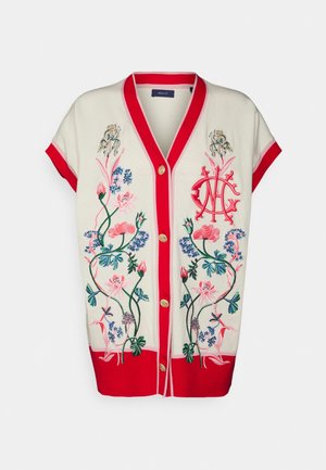 Cardigan crème à manches courtes avec bordure rouge, boutons dorés et motifs floraux brodés colorés sur le devant.