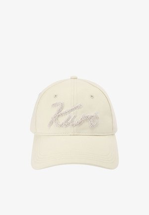 Casquette de baseball beige à visière incurvée arborant une broderie en relief avec l'inscription "Zara" sur le panneau avant.