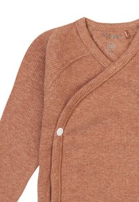 Ribbed, rust-colored baby cardigan with a V-neck, wrap design, and white snap closures. Label indicates size 56 (1-2 months).