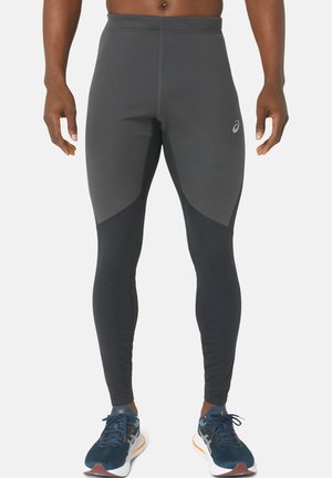 Black athletic leggings with a textured, stretch fabric. Features a contrasting dark grey panel on the sides and a small logo on the hip.