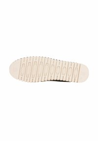 Suola di scarpa in gomma con una superficie testurizzata e decorata di colore beige chiaro. Presenta scanalature per la trazione e dettagli del logo.