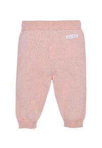 Pantaloni per neonati in maglia rosa con vita e polsini a coste, con un piccolo etichetta cucita sul retro. Texture morbida e gambe affusolate.