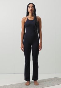 Nike Performance ZENVY WOMENS DRI FIT FULL LENGTH FLARED BODYSUIT - Gimnastički dres - black/(pcg6c)