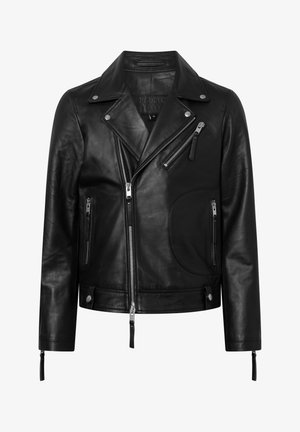 Musta nahkainen moottoripyöräczakki epäsymmetrisellä etuvetoketjulla, sivutaskuilla ja hopeisilla yksityiskohdilla. Varustettu lovetulla kauluksella ja vetoketjullisilla hihoilla.