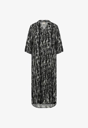 Vestido negro con mangas cortas, escote en V y un corte holgado. Presenta un patrón abstracto en blanco que recuerda líneas y texturas.