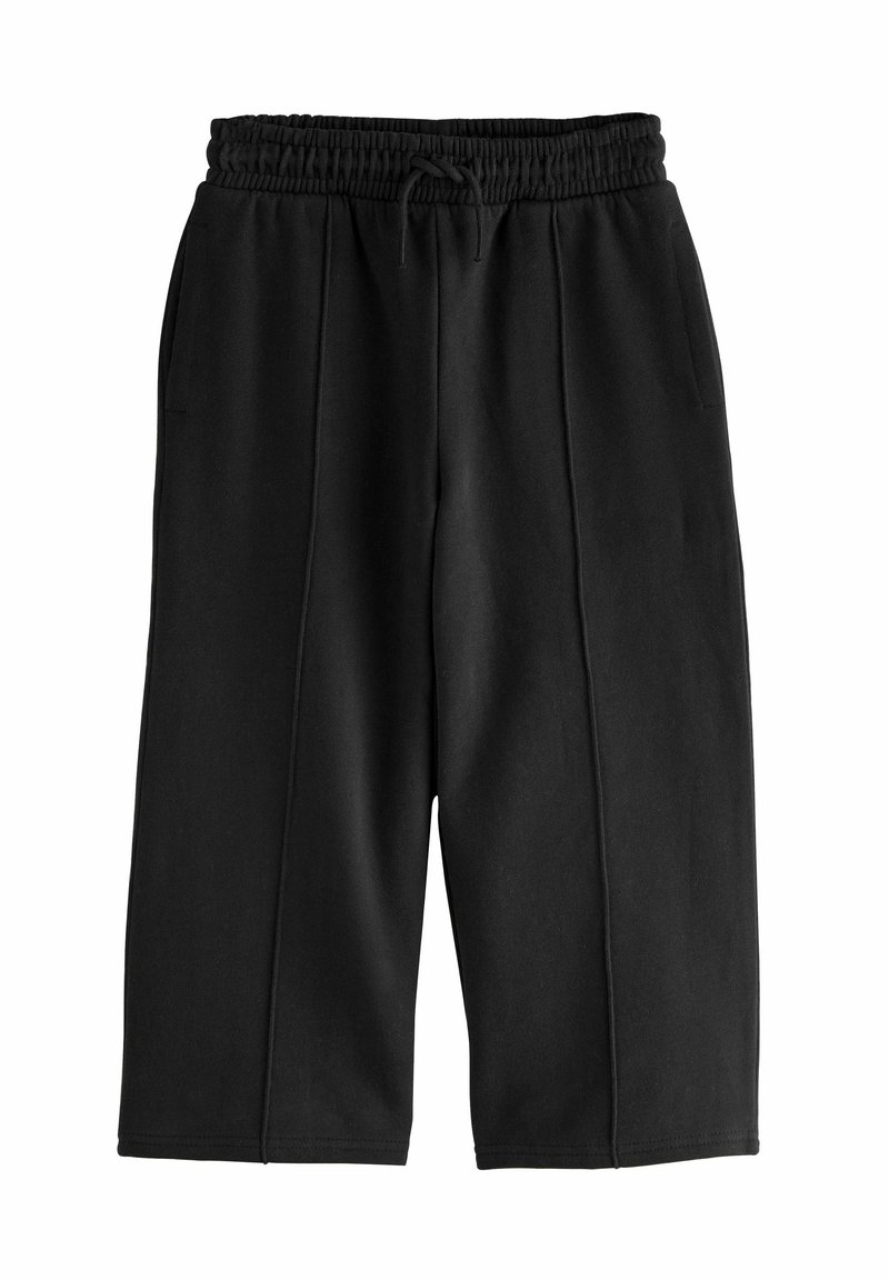 Pantalon noir large et court avec taille élastique et cordelette, avec des détails de couture à l’avant et des poches latérales.