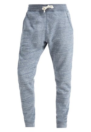 Grijze joggers van een zachte stof met rekbaar materiaal, elastische tailleband en verstelbaar trekkoord. Voorzien van zijzakken en taps toelopende benen.