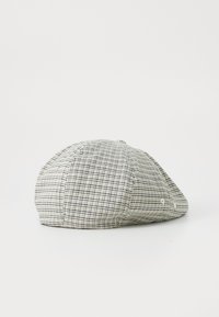 Een platte pet met een geruit patroon in zwart en beige, gemaakt van een gestructureerde stof. Heeft een afgeronde bovenkant en zijventilaties.