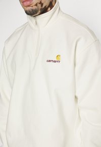 Carhartt WIP HALF ZIP AMERICAN SCRIPT - Collegepaita - wax