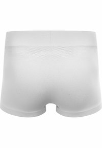 Boxers blancs en tissu doux et lisse avec une taille texturée. Présentent une coupe arrondie et un motif en maille respirante à l'arrière.