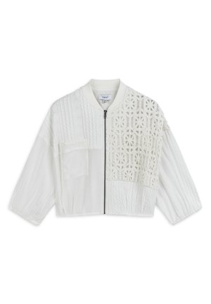 White cropped jacket featuring a mix of textured materials, a front zipper, and a detailed crochet pattern on one side.