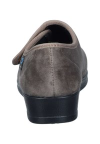 Gray suede shoe with a rounded design, a flexible black sole, and a fabric collar. Features a small branding label on the side.
