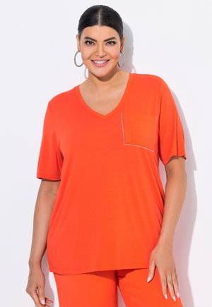V-hals, T-shirt met korte mouwen in fel oranje met een zak en een subtiele parelrand. Zacht, lichtgewicht stof met een relaxte pasvorm.